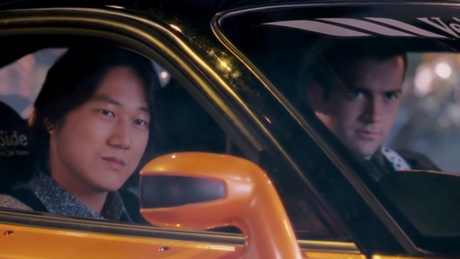 Han and Sean sit in a super car in The Fast and the Furious: Tokyo Drift