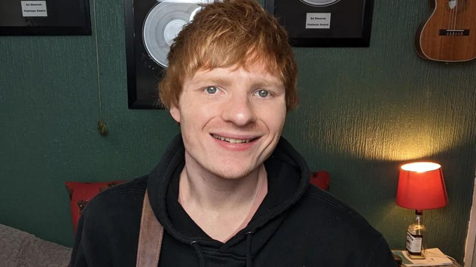 Ed Sheeran's lookalike, Ty Jones, smiles for the camera.