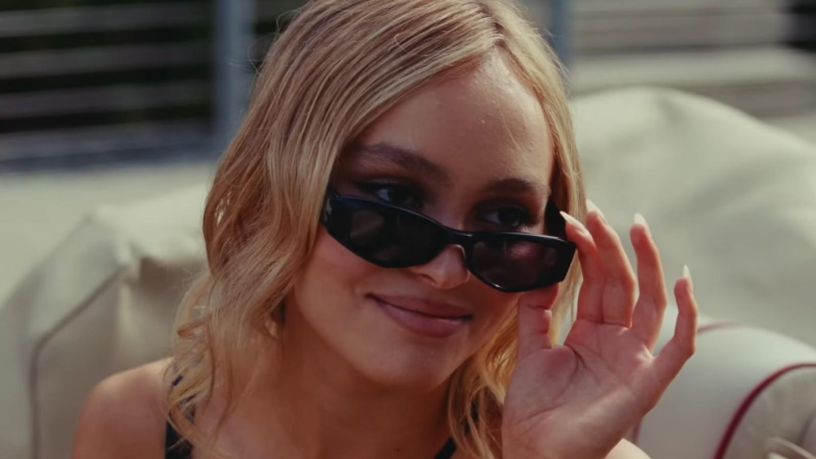 A close up of Lily-Rose Depp wearing sunglass in The Idol