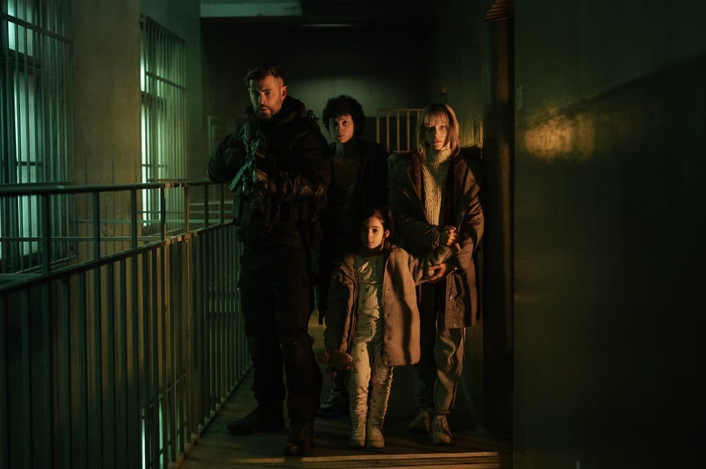Chris Hemsworth as Tyler Rake, Andro Jafaridze as Sandro, Miriam and Marta Kovziashvili as Nina and Tinatin Dalakishvili as Ketevan in Extraction 2.