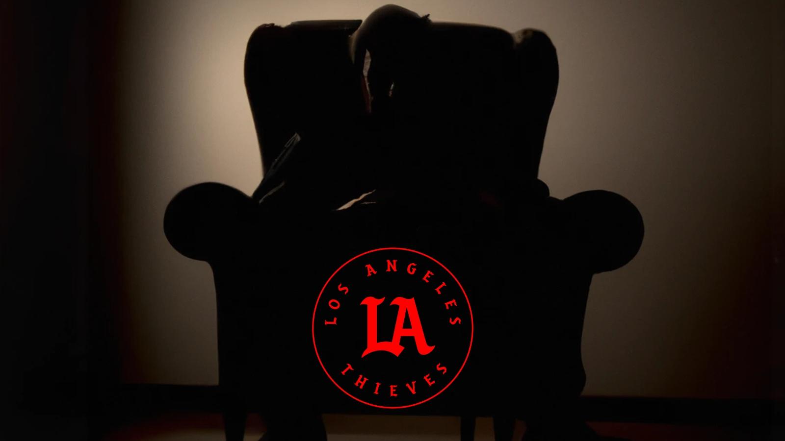 silhouetted man in armchair with LA Thieves logo