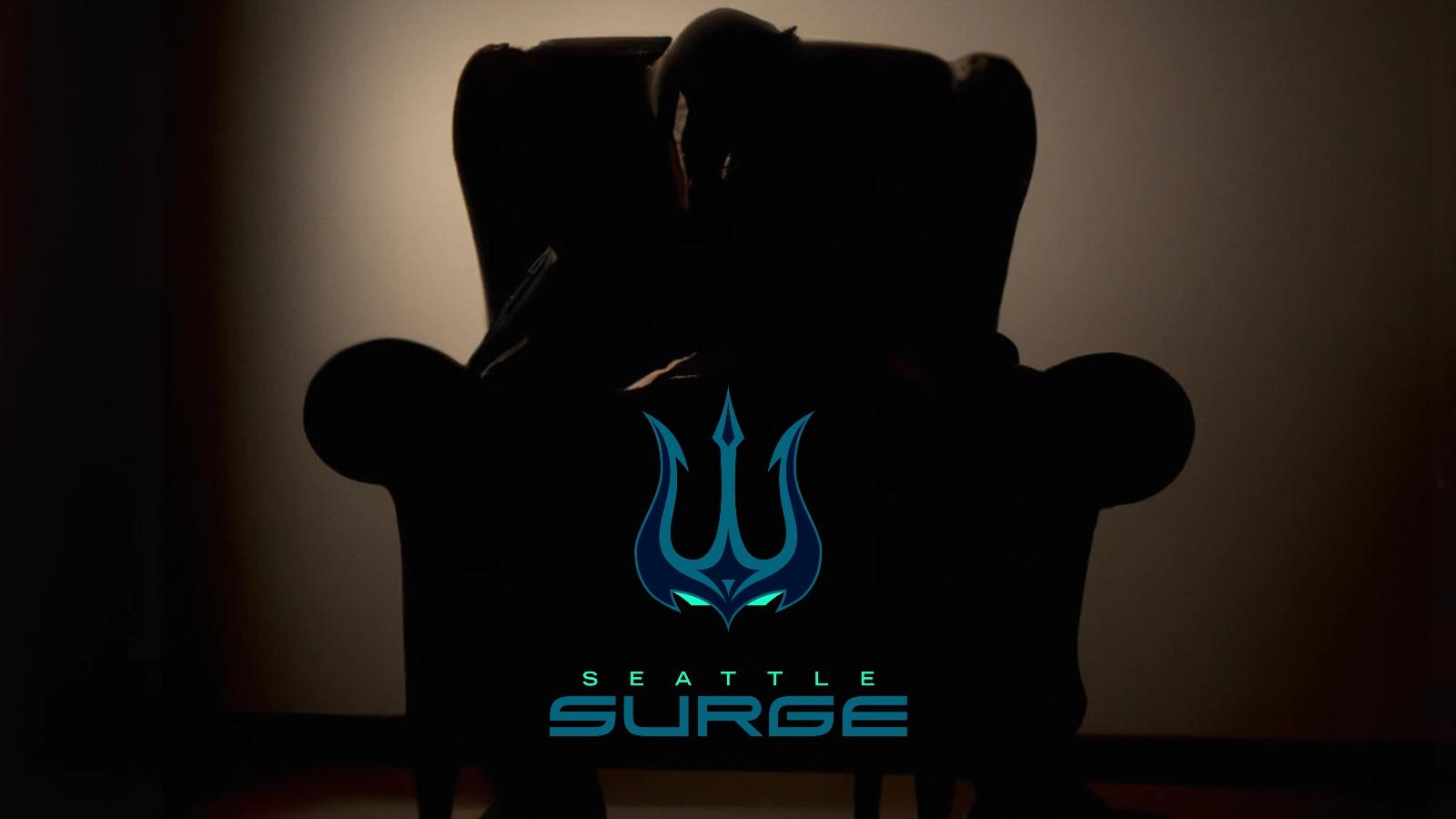 Silhouette of a man in an armchair with a Seattle Surge logo in the middle