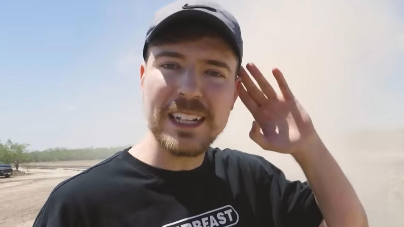 YoUTuber MrBeast holding his hand to ear