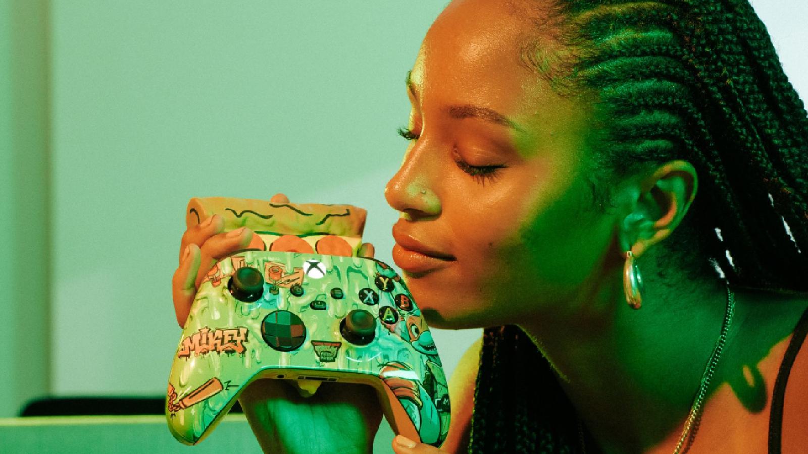Woman smelling pizza scented xbox controller