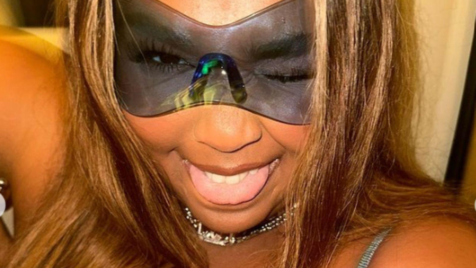Lizzo posing with glasses on