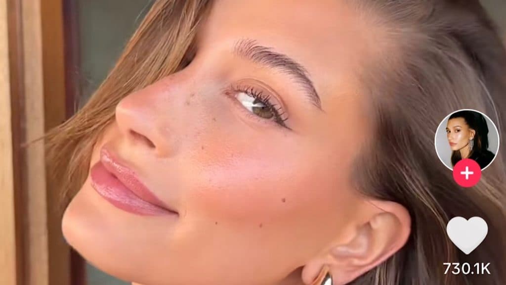 Hailey Bieber shows off her 'strawberry girl' makeup trend.