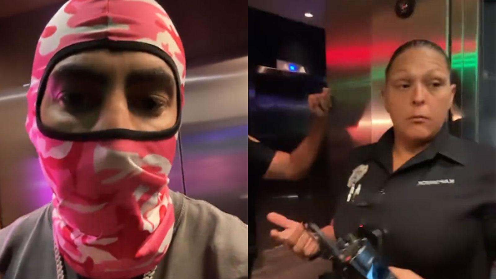 Fousey wearing balaclava next to female police officer