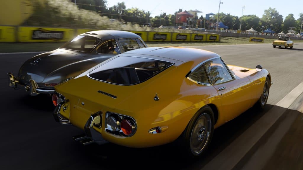 Classic sports cars racing each other in Forza Motorsport.