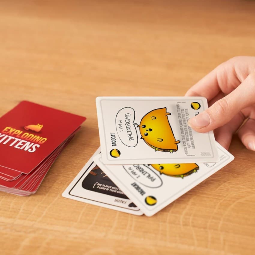 Exploding Kittens cards being played