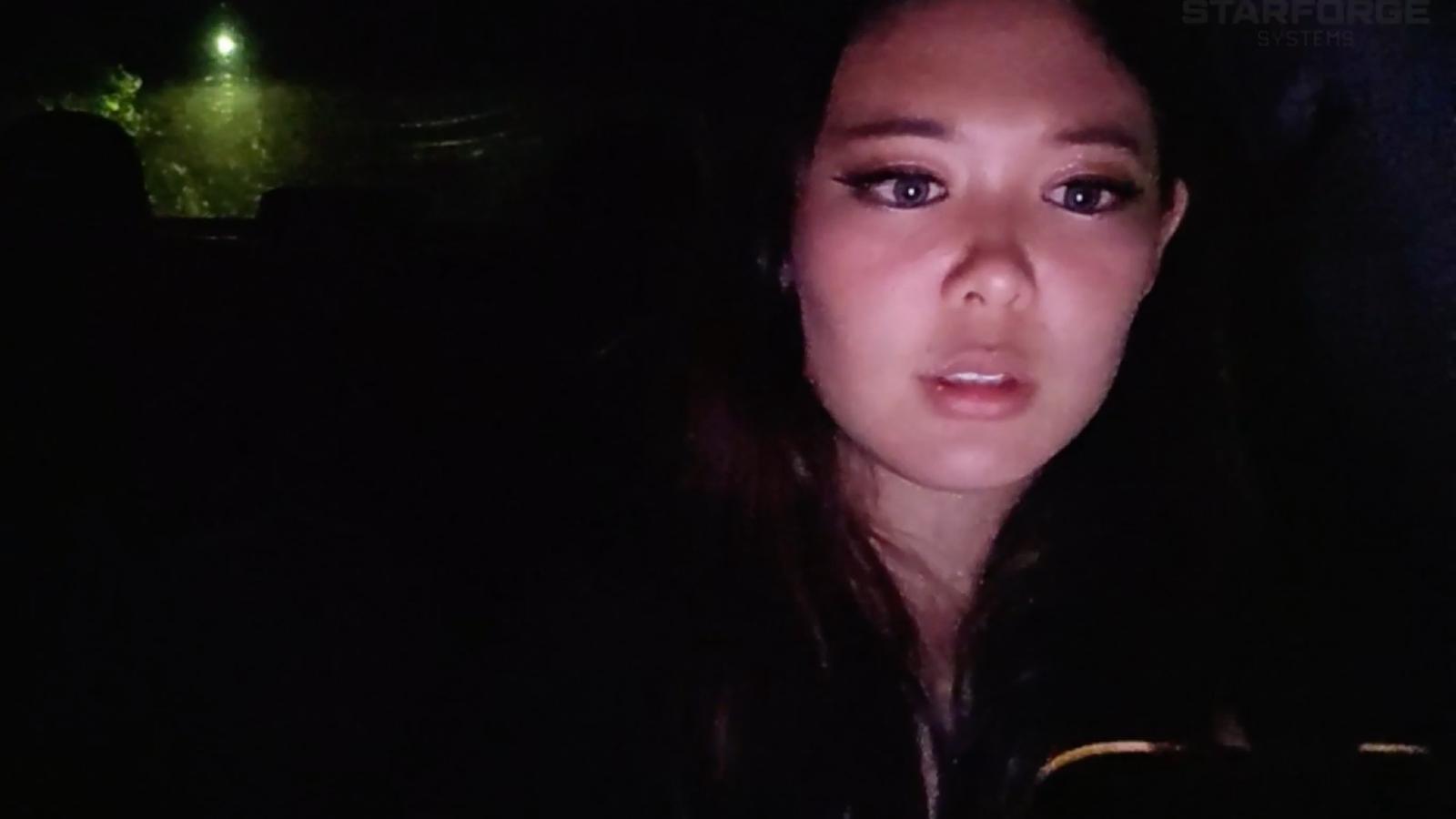 ExtraEmily looking at her phone while in the car during Twitch stream
