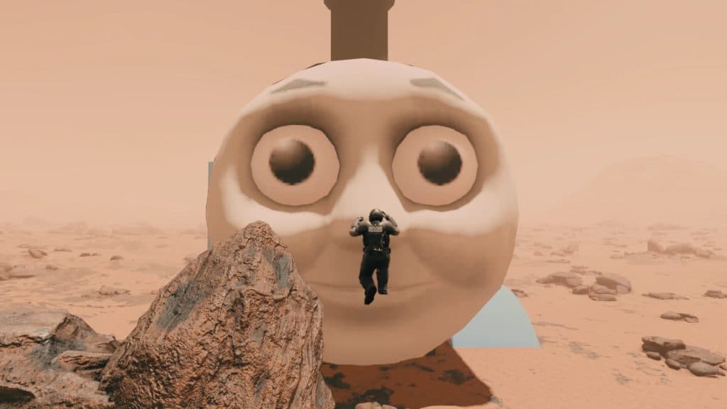 Starfield player jumping in front of a giant Thomas the Tank Engine
