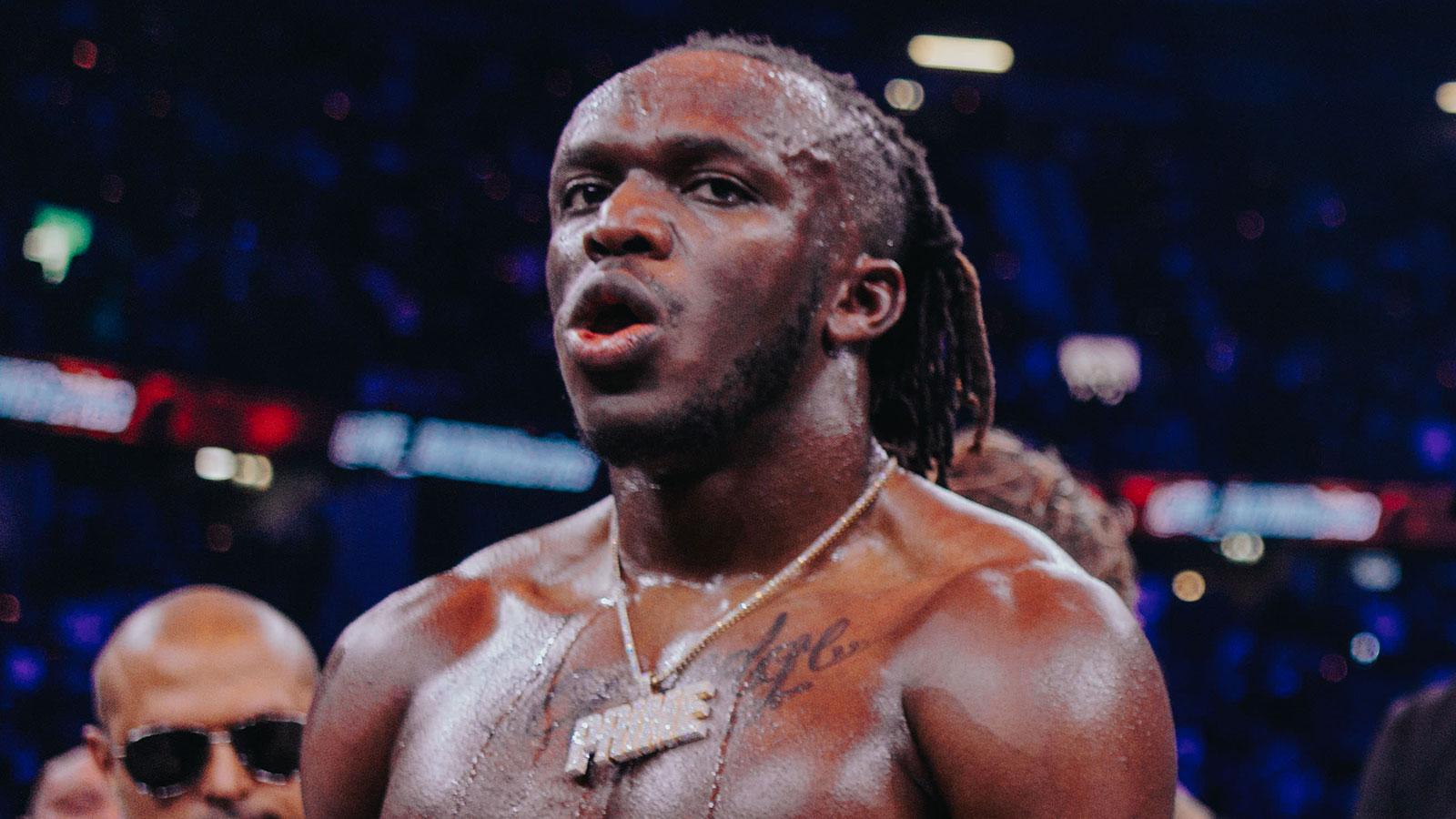 KSI wearing 'Prime' chain in boxing ring with Tommy Fury