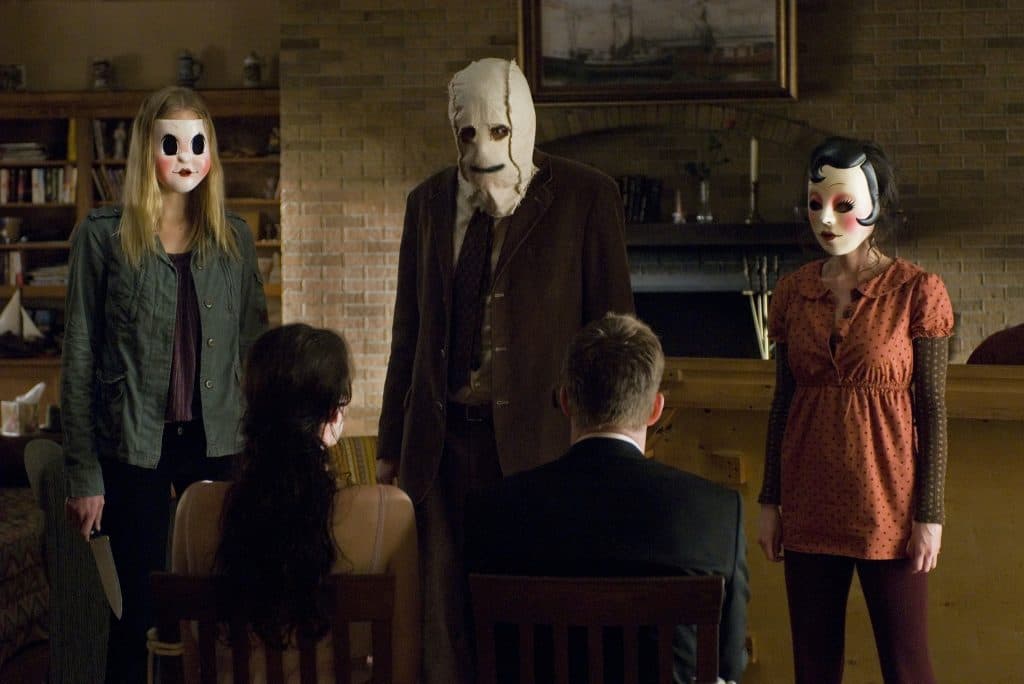 A still of the intruders in The Strangers