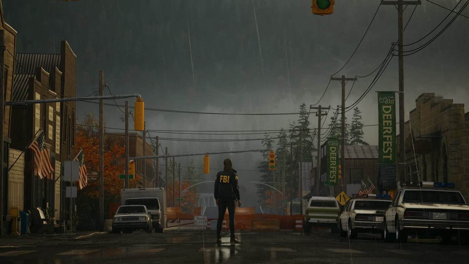 An FBI agent stands at the entrance to a town in Alan Wake 2