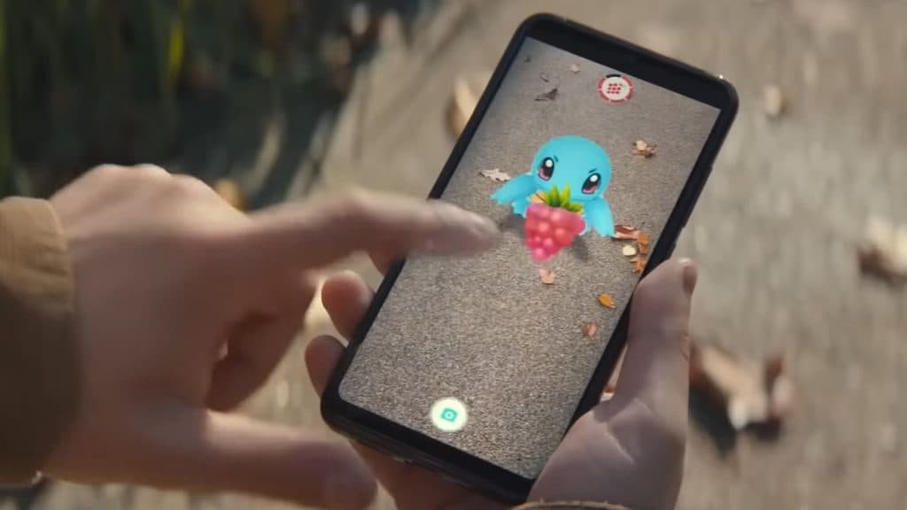 Feeding Buddy Squirtle to get candy faster in Pokemon Go.