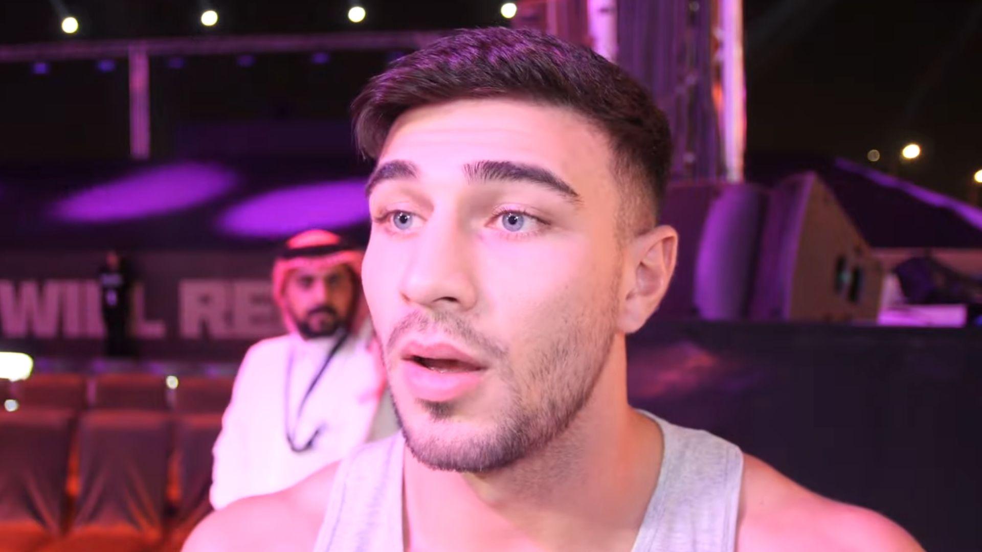 Tommy Fury in white vest top talking to camera