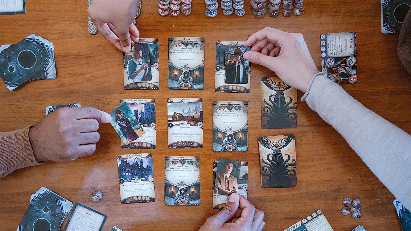 Arkham Horror card game hands holding cards