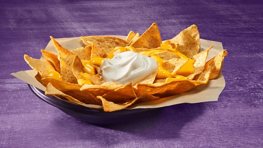 Image shows an order of cheesy nachos from Taco Bell.