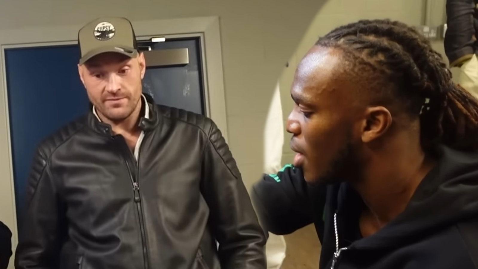 KSI sat getting his hands wrapped with Tyson Fury watching in the background