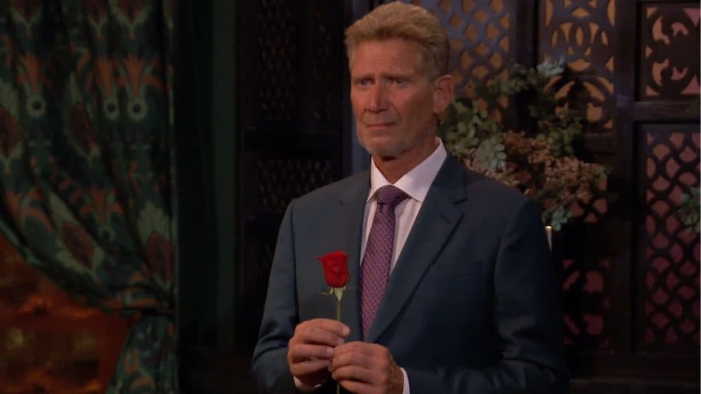 Golden Bachelor's Gerry Turner giving a rose