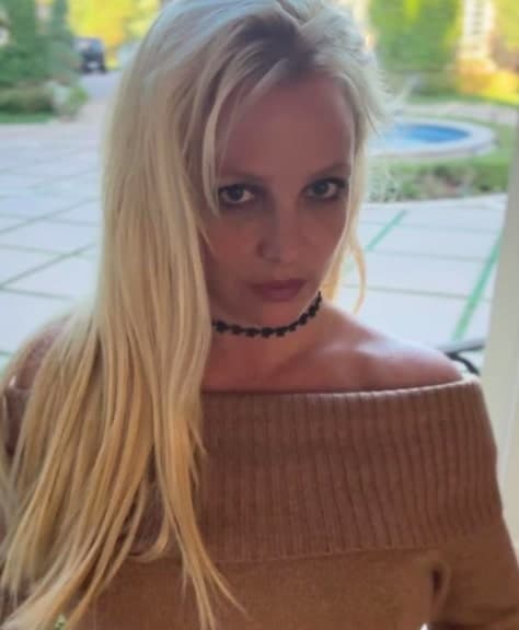 Britney Spears standing close to the camera for a candid portrait.