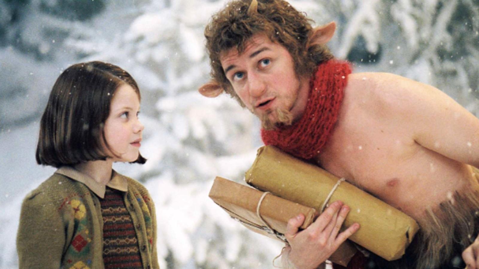 Georgie Henley as Lucy Pevensie and James McAvoy as Mr. Tumnus in The Chronicles of Narnia: The Lion, the Witch and the Wardrobe
