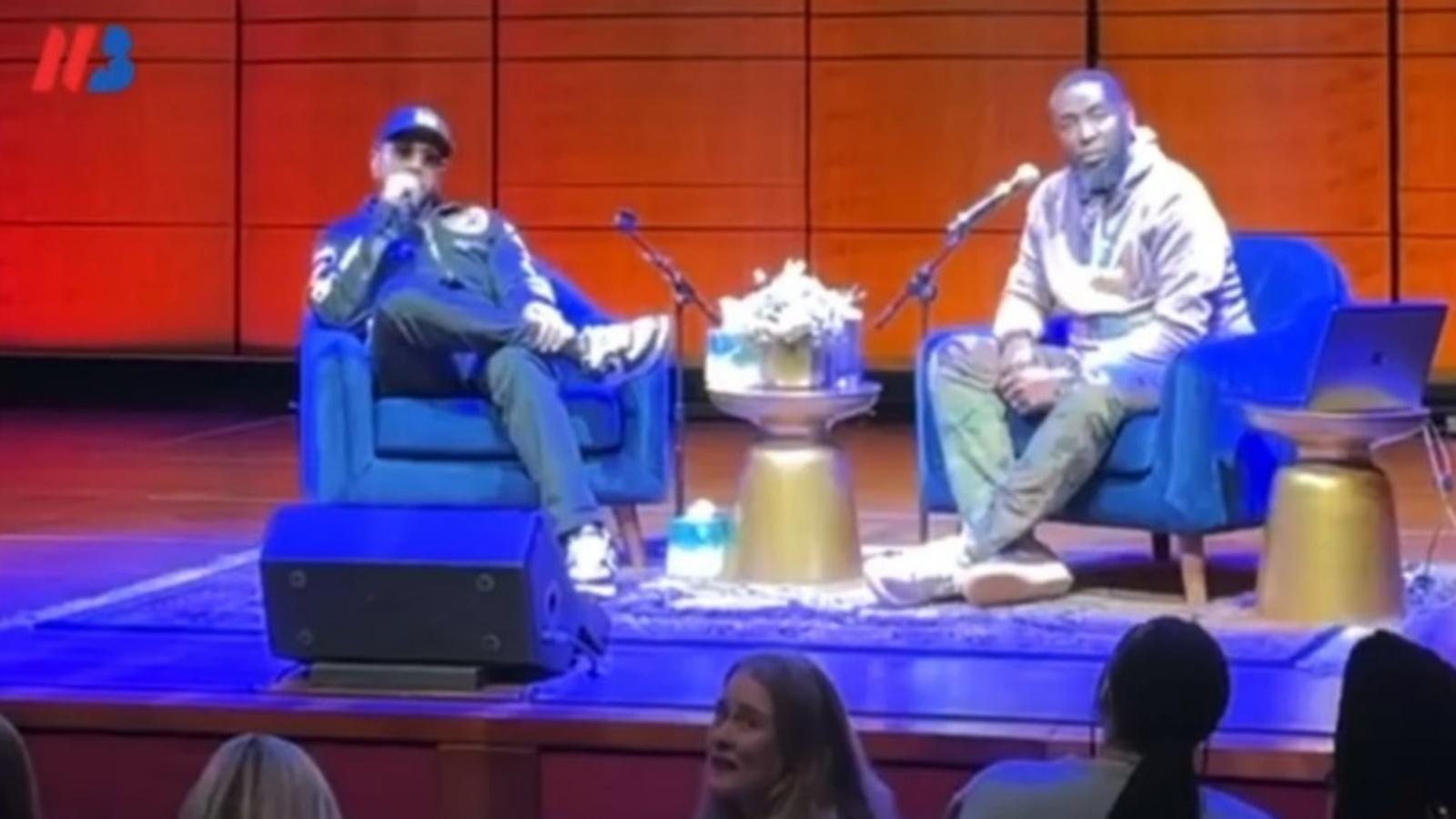 Producer Timbaland sitting on a stage answering questions.