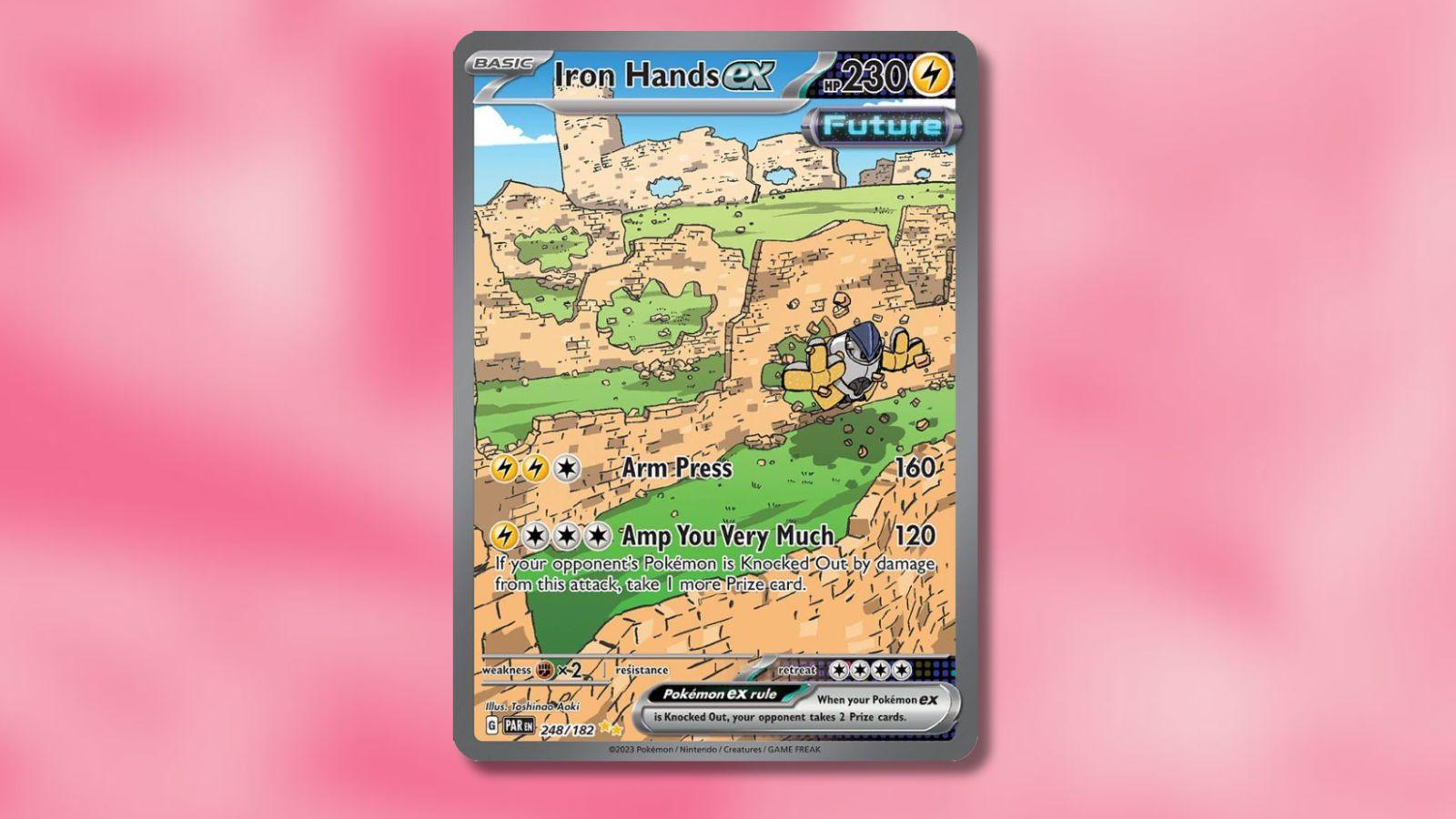 The Iron Hands Ex Pokemon card is placed against a pink background