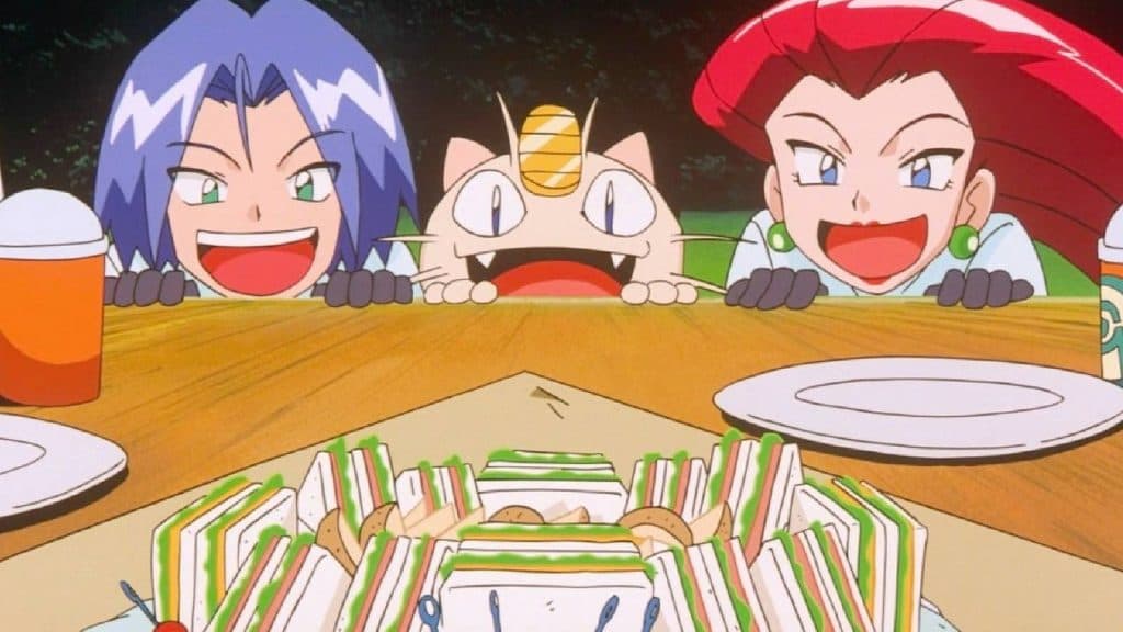 Team Rocket and Meowth look hungrily at a table filled with food