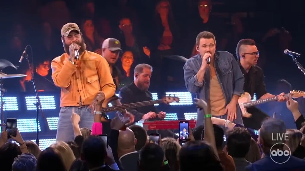 Post Malone and Morgan Wallen perform onstage at the CMA Awards