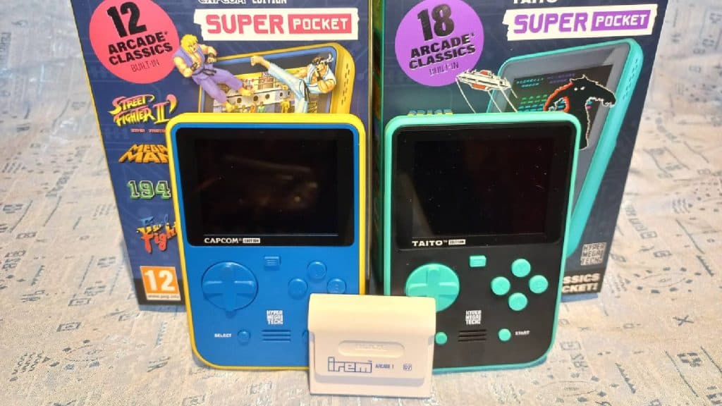 Two Super Pocket handhelds with boxes