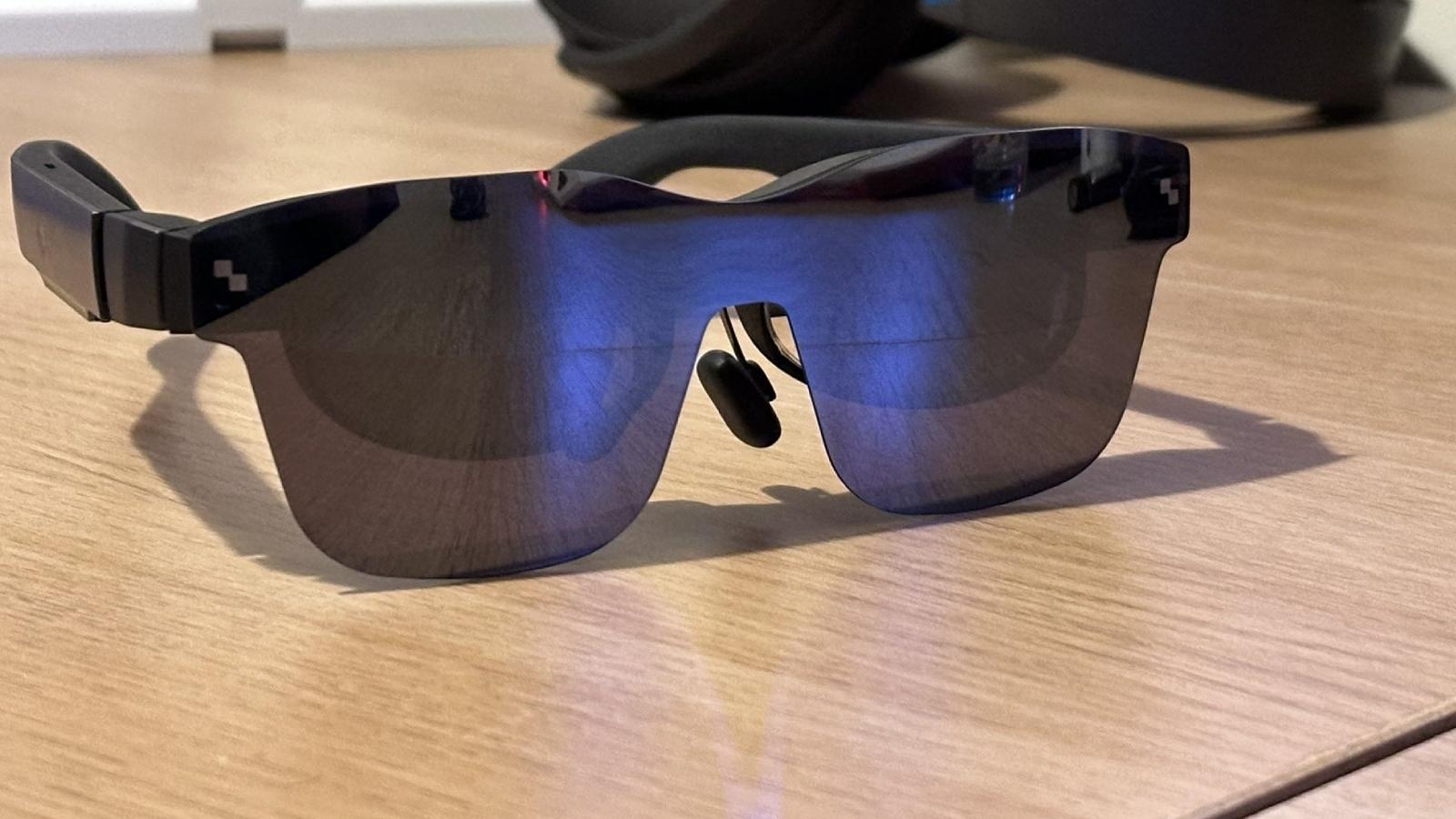 TCL RayNeo Air 2 glasses on a desk