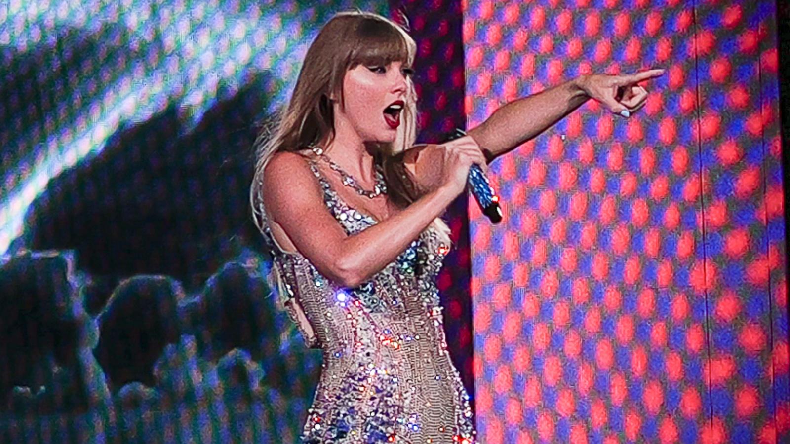 Taylor Swift performing onstage at a concert