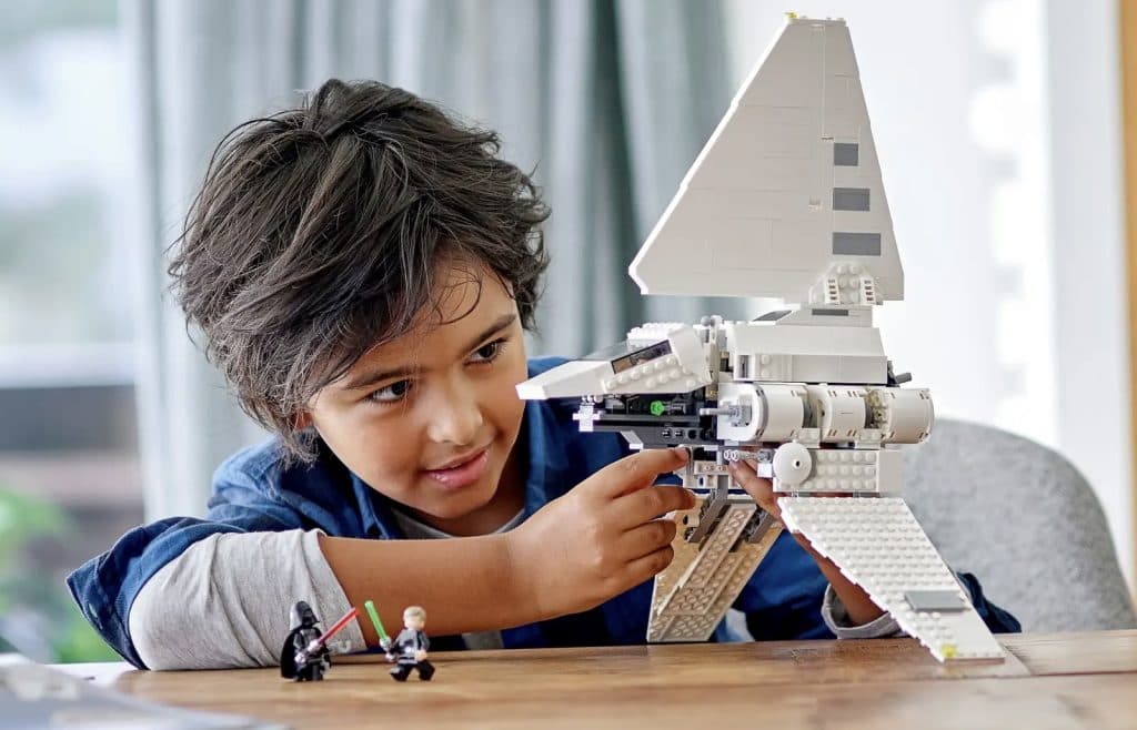Child playing with the LEGO Star Wars Imperial Shuttle.