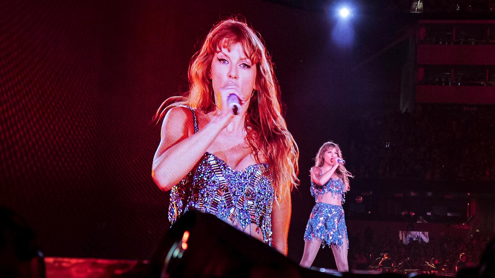 Taylor Swift performing onstage at a concert