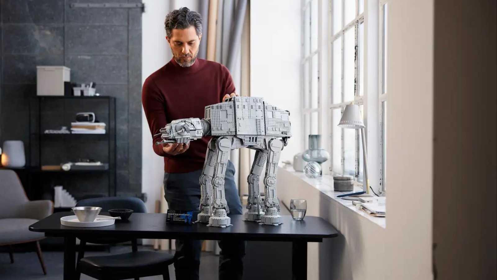 Adult positioning the LEGO Star Wars AT-AT.