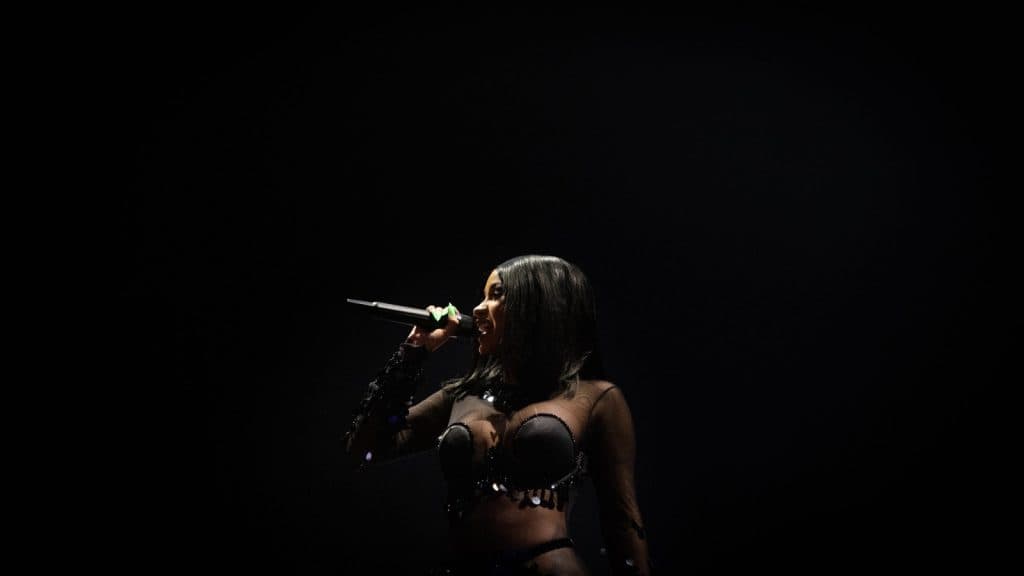 Cardi B performing onstage at a concert