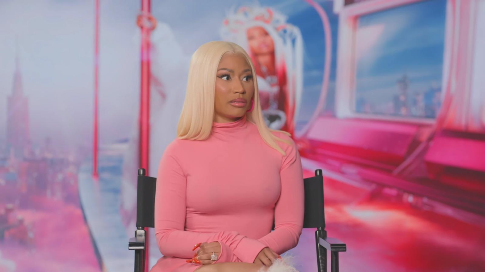 Nicki Minaj on a stage being interviewed