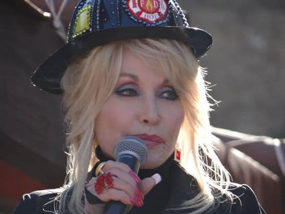 Dolly Parton speaking to a crowd at Dollywood