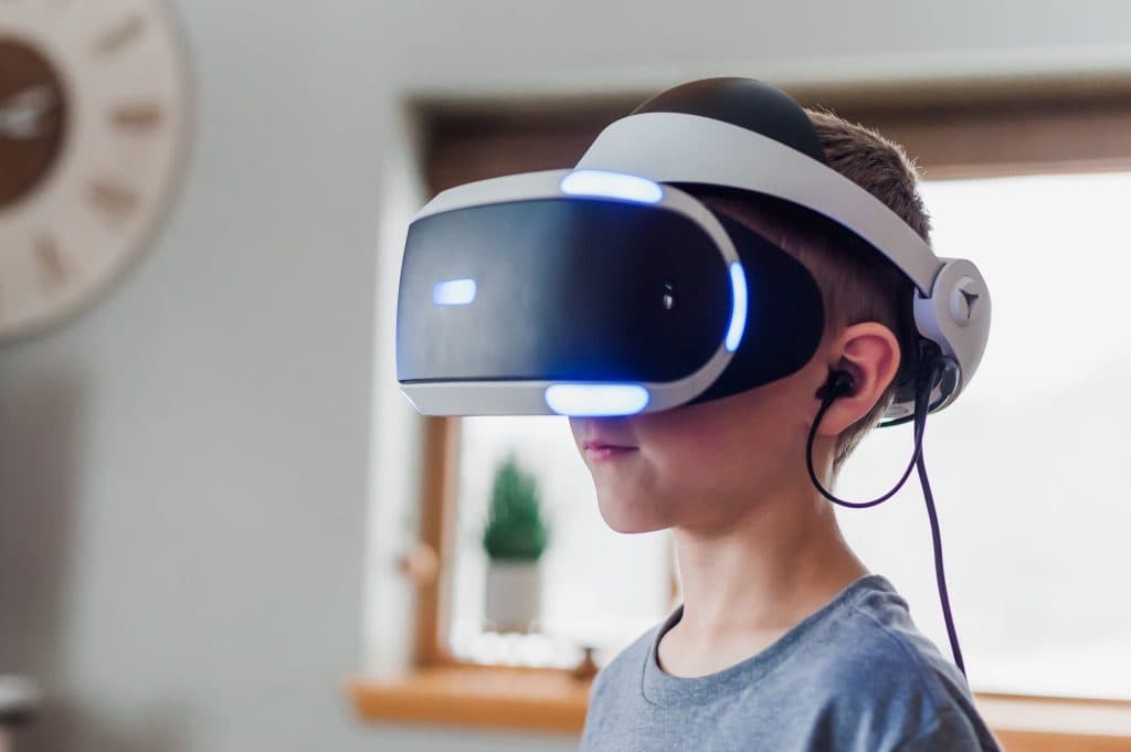 A child wears a VR headset.