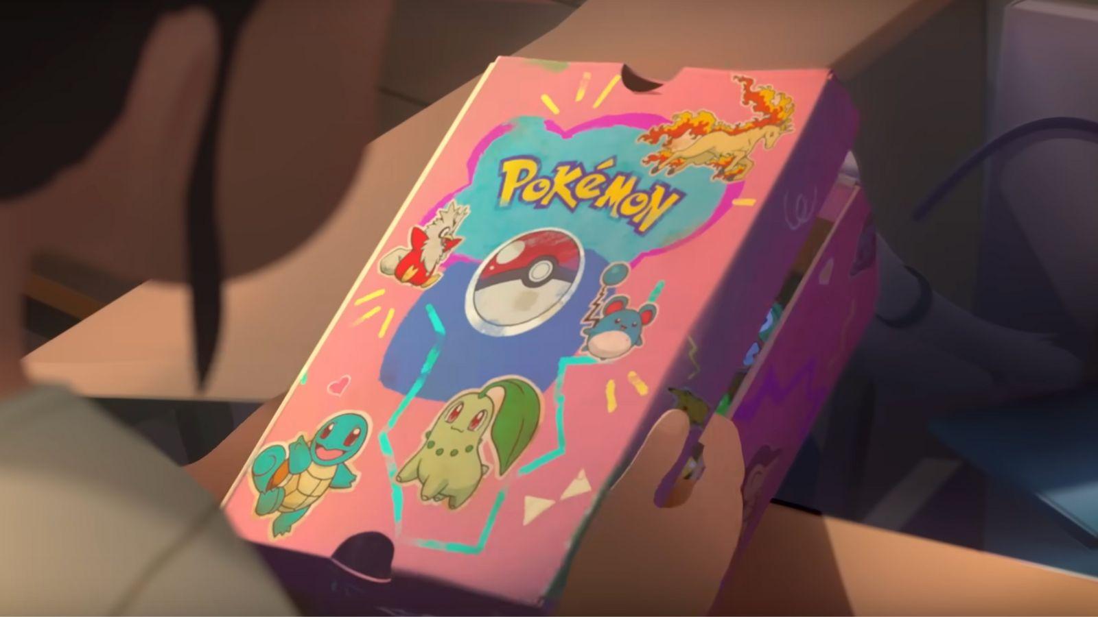Scene from Path to the peak showing a cardboard box with Pokemon cards