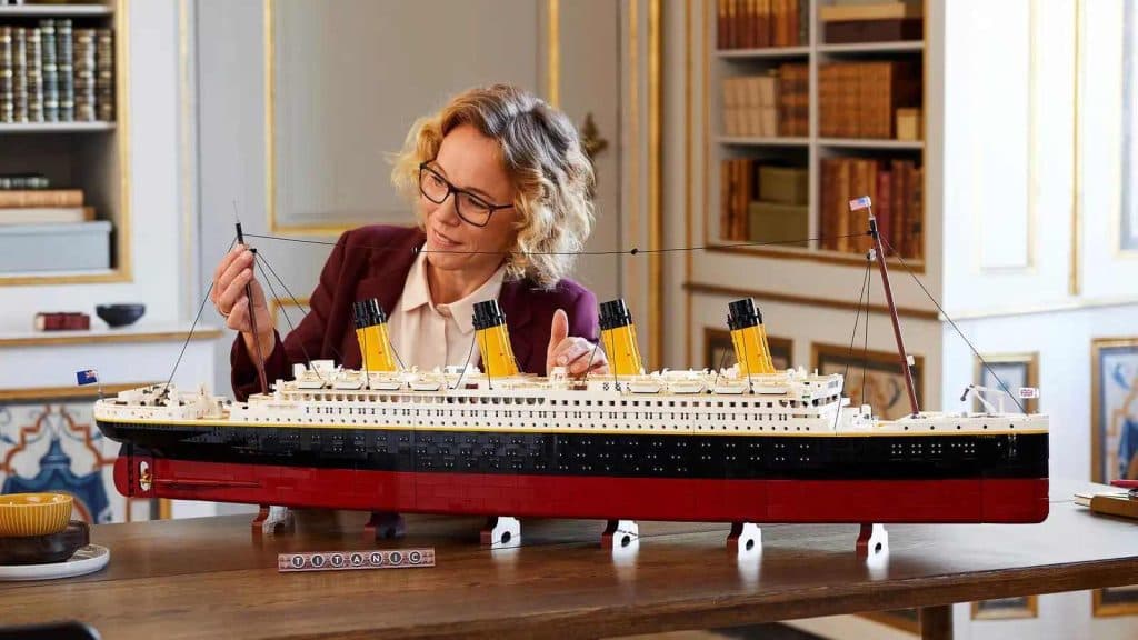 An adult admiring their LEGO Icons Titanic set. It's the most expensive LEGO Icons kit.