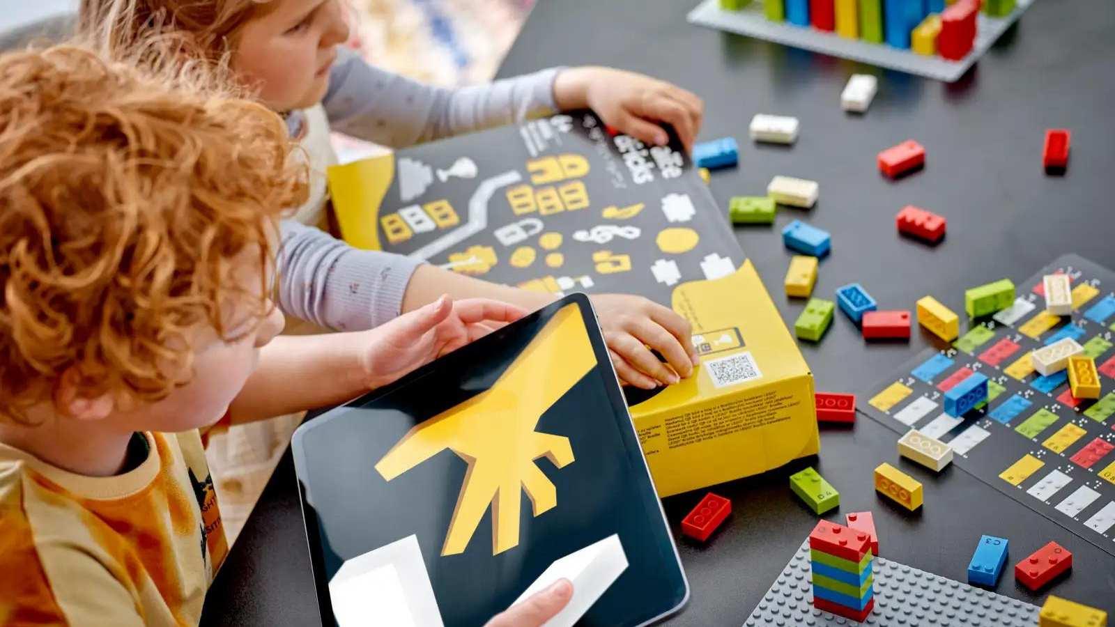 Children playing with LEGO Braille Bricks