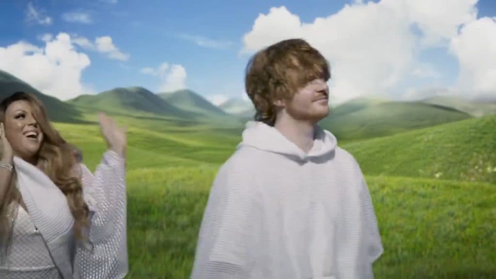 Mariah Carey and Ed Sheeran impersonators standing in a field in Lil Nas X's video