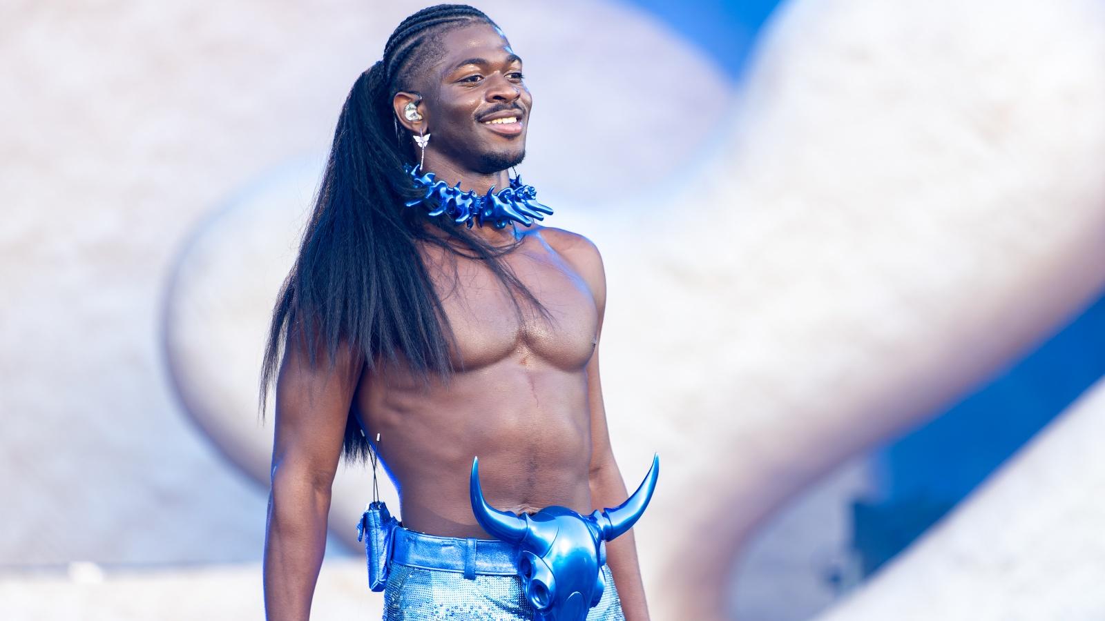 Lil Nas X performing onstage during a concert