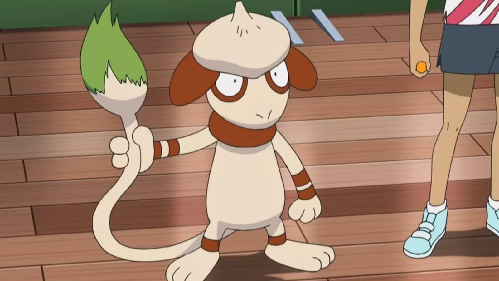 The Pokemon Smeargle stands in the middle of a room, holding its tail like a paintbrush