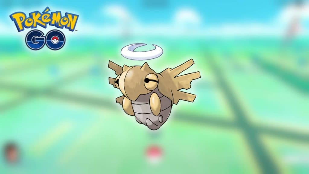 The Pokemon Shedinja appears against a blurred background