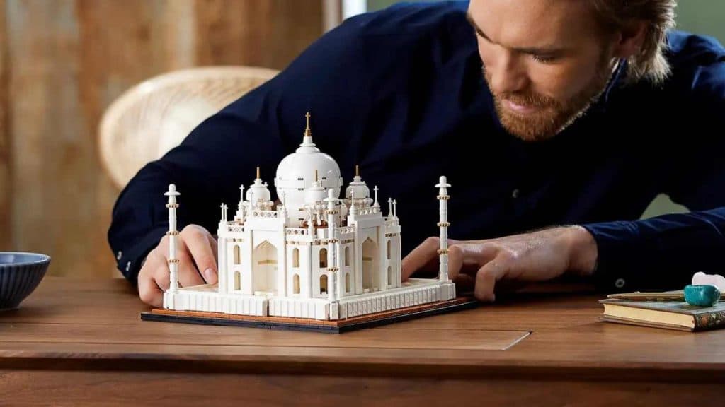 An adult admiring their LEGO Architecture Taj Mahal set