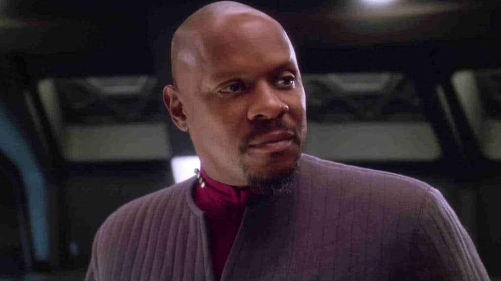Captain Benjamin Sisko from Deep Space Nine stares at a list of the war dead.