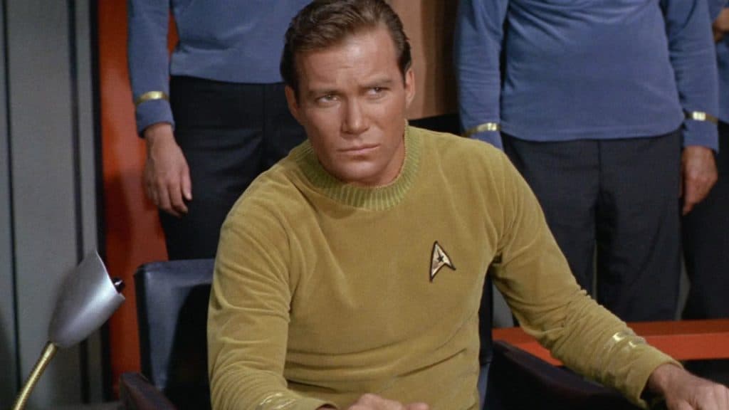Captain James T Kirk from Star Trek looking perplexed on the bridge of the Enterprise.
